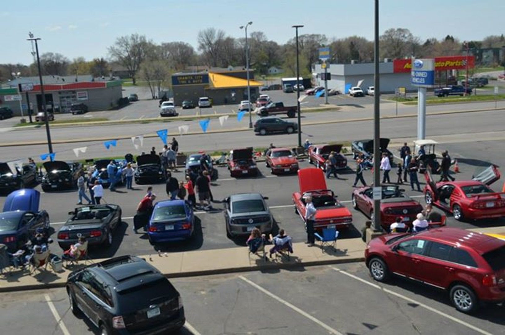 Car show gathering in parking lot