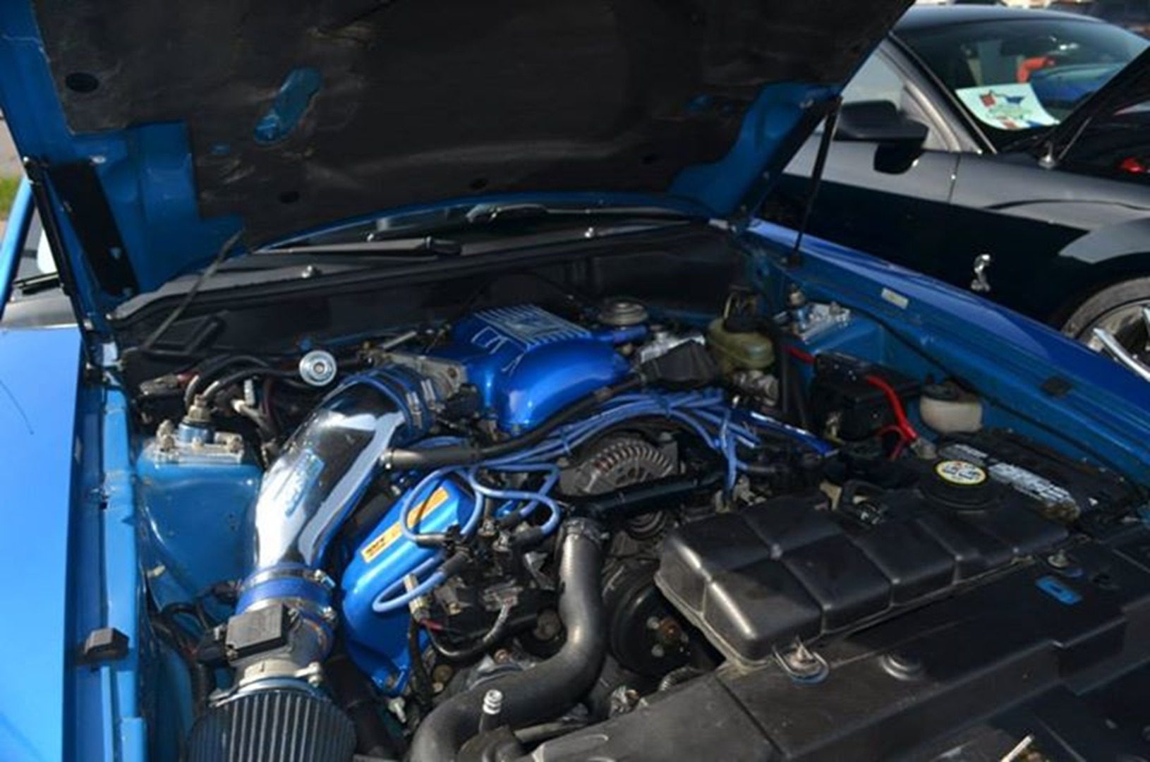 Open hood showing custom engine