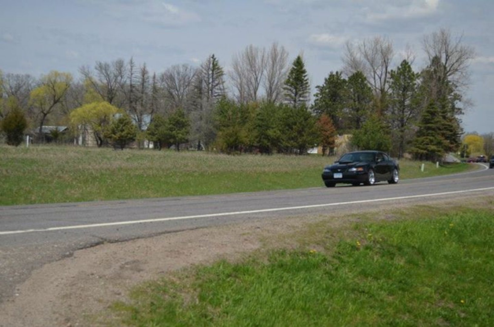 Black car in countryside setting