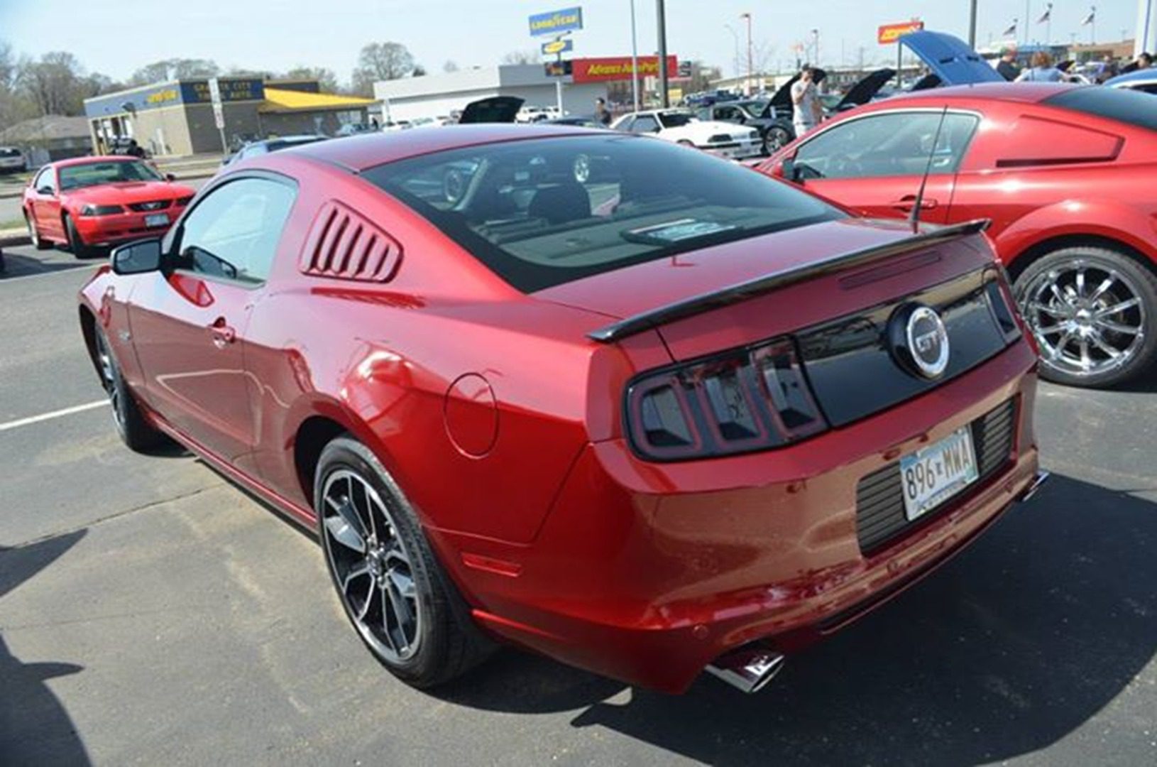 Red sports car in parking lot