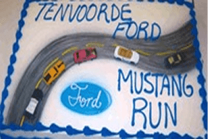 Decorative cake featuring toy cars and road