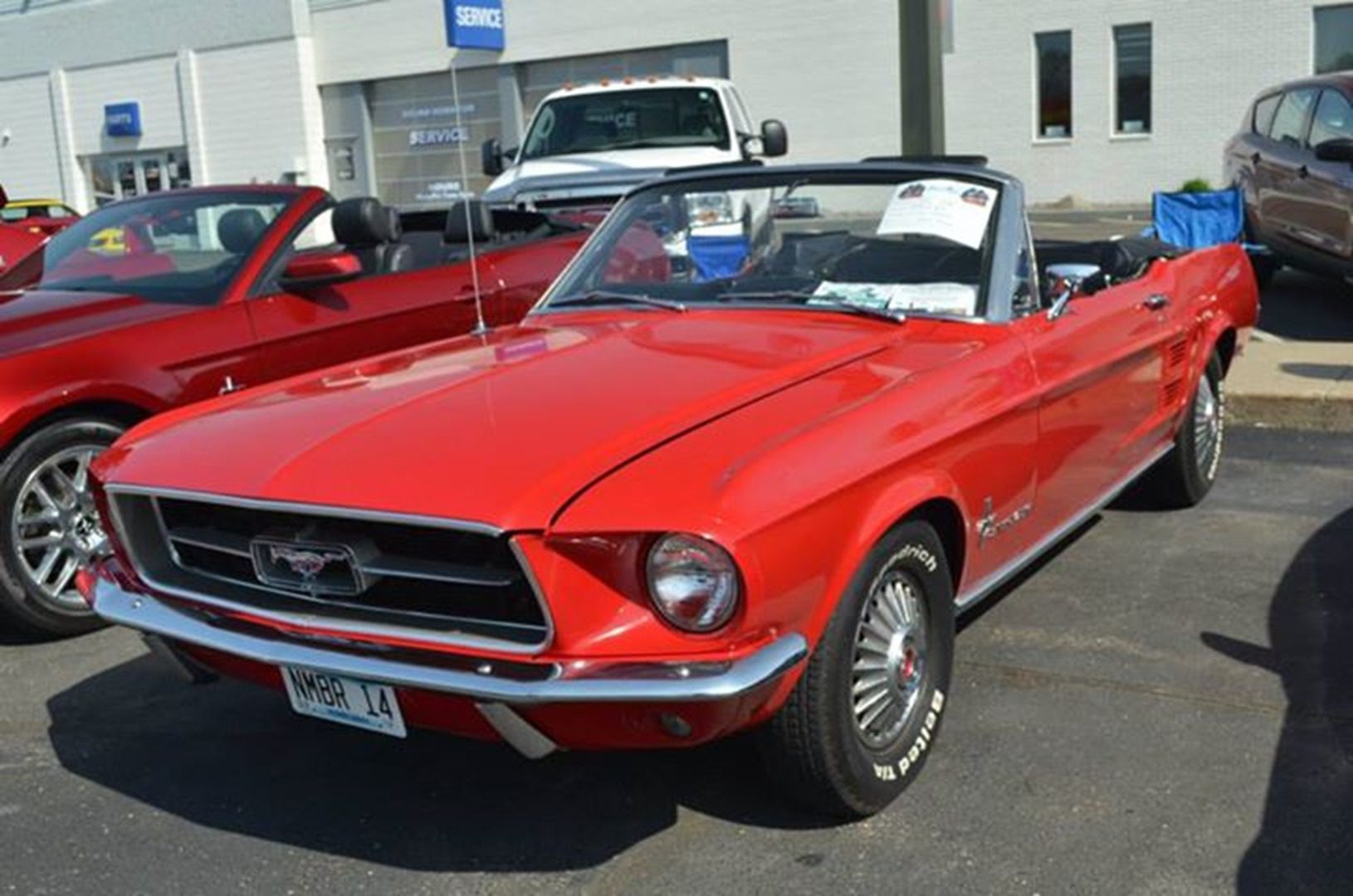 Red classic convertible car at auto show