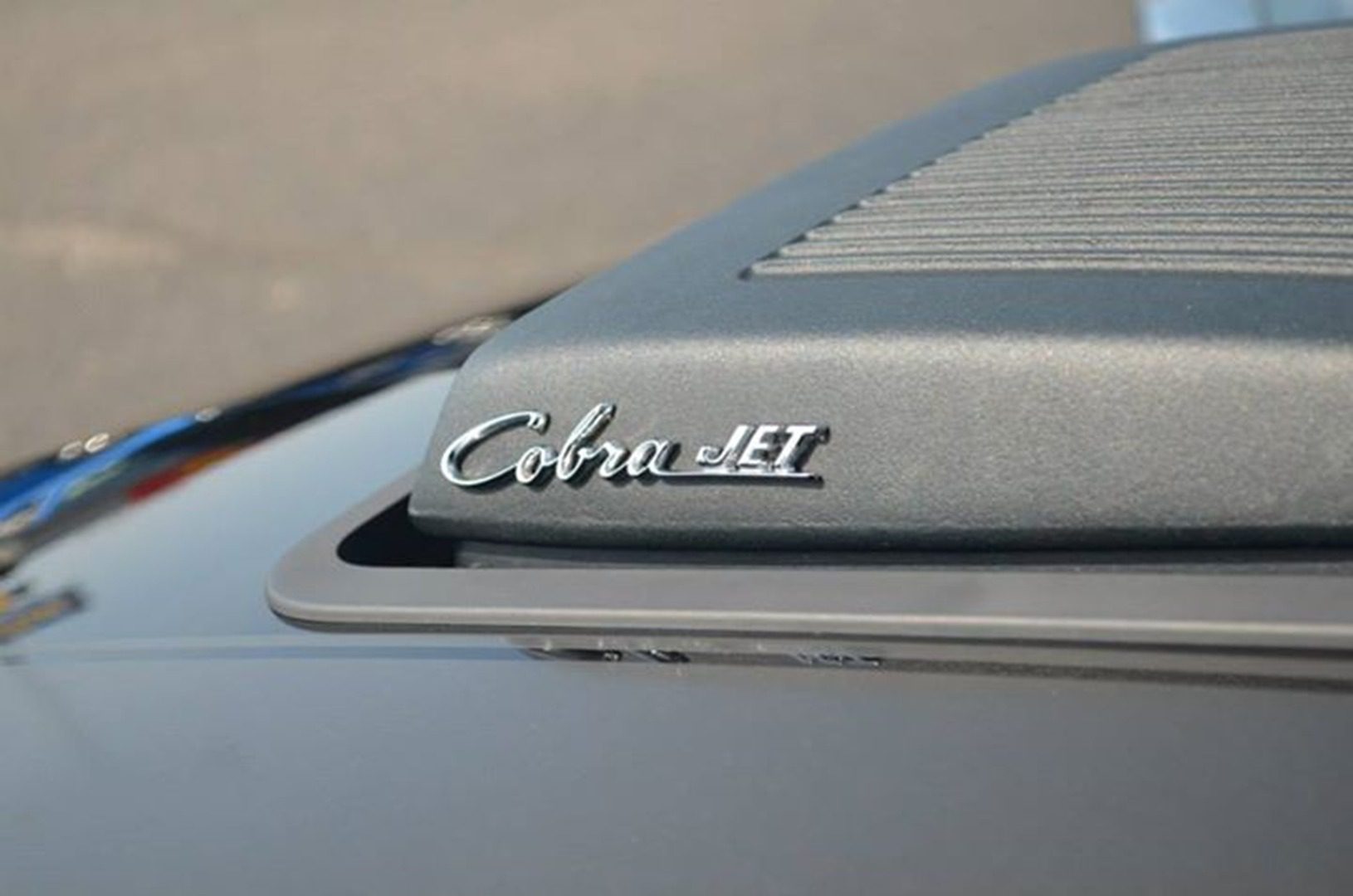 Car hood with Cobra Jet logo