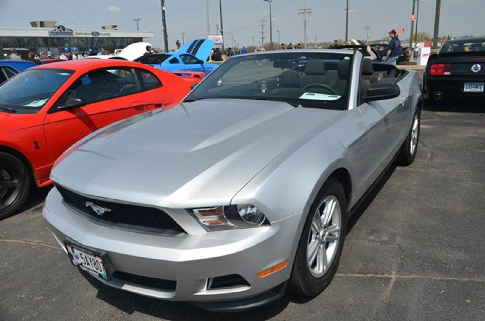 Silver convertible car at outdoor event