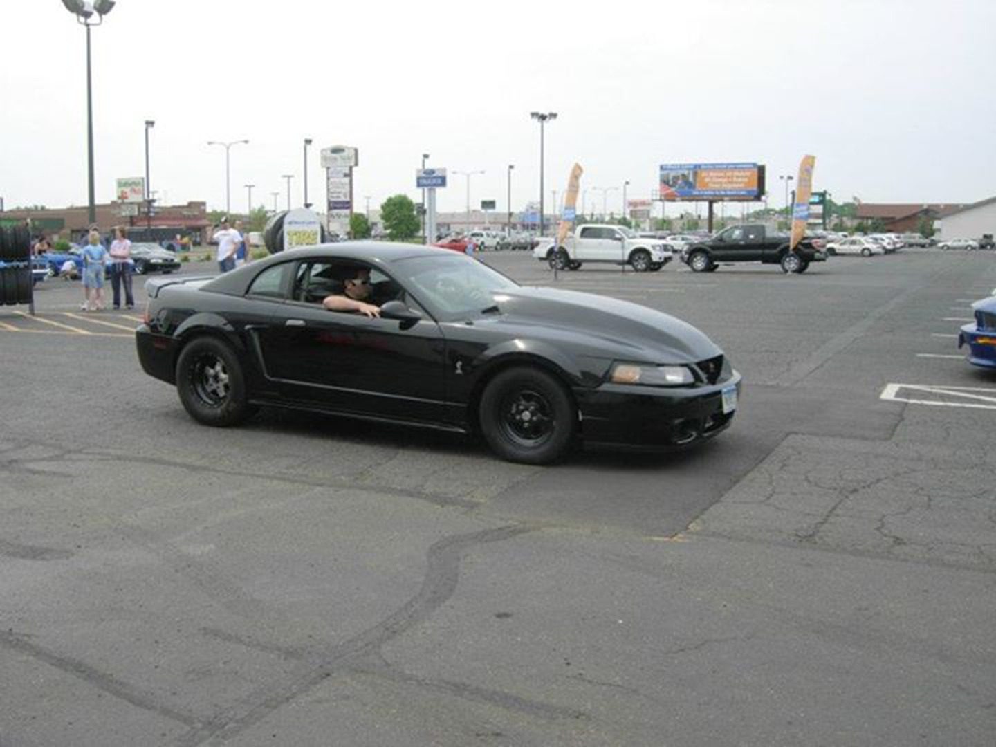 Mustang driving in urban area